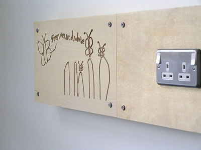 Pupils drawings cut into plywood dado