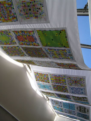 Textile hanging using computer programme and pupils photographs to explore patterns in maths